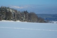 Cesta ubíhala poklidně a brzy se před námi otevřela nádherná panoramata. Vítají nás Krkonoše.
